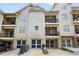 Three-story townhome featuring a garage and a private balcony on each level at 6459 Chariot St # 35, Atlanta, GA 30328