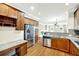Well-equipped kitchen with stainless steel appliances, granite countertops, and wooden cabinetry at 6459 Chariot St # 35, Atlanta, GA 30328