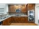 The kitchen is equipped with granite countertops, stainless steel appliances, and wood cabinets at 6459 Chariot St # 35, Atlanta, GA 30328