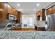 Granite countertops and stainless steel appliances are the highlights of this eat-in kitchen at 6459 Chariot St # 35, Atlanta, GA 30328