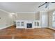 Bright living room with hardwood floors, fireplace, built-ins, and a neutral color scheme, perfect for relaxation at 6459 Chariot St # 35, Atlanta, GA 30328