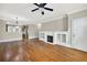 Open living room with hardwood floors, fireplace, built-in cabinets, and convenient access to the kitchen at 6459 Chariot St # 35, Atlanta, GA 30328