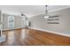 Spacious living room featuring hardwood floors, large windows, and modern lighting at 6459 Chariot St # 35, Atlanta, GA 30328