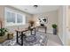 Bright office space with a gray carpet, decorative rug, and a big window at 6459 Chariot St # 35, Atlanta, GA 30328