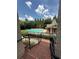 View of the community pool with pool house from elevated brick staircase at 6459 Chariot St # 35, Atlanta, GA 30328