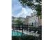 Great shot of the refreshing community pool surrounded by lush landscaping and inviting lounge chairs at 6459 Chariot St # 35, Atlanta, GA 30328