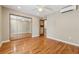 Bright bedroom with hardwood floors and mirrored closet, providing an airy and spacious feel at 1023 Riverbend Club Se Dr, Atlanta, GA 30339