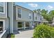 Back exterior of townhome with deck and fenced yard, offering outdoor living space and privacy at 1023 Riverbend Club Se Dr, Atlanta, GA 30339