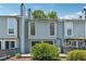 Back exterior of townhome with deck and fenced yard, providing a private outdoor space at 1023 Riverbend Club Se Dr, Atlanta, GA 30339