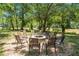Outdoor fire pit with seating, perfect for gatherings and enjoying the natural surroundings at 1023 Riverbend Club Se Dr, Atlanta, GA 30339