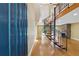 Bright foyer with hardwood floors, a spiral staircase, and a unique glass block window at 1023 Riverbend Club Se Dr, Atlanta, GA 30339