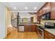 Well-equipped kitchen with stainless appliances, granite countertops, and an open layout at 1023 Riverbend Club Se Dr, Atlanta, GA 30339