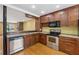 Kitchen area with stainless steel appliances and granite countertops at 1023 Riverbend Club Se Dr, Atlanta, GA 30339