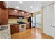 Well-lit kitchen with stainless steel appliances, granite countertops, and ample cabinet space at 1023 Riverbend Club Se Dr, Atlanta, GA 30339