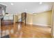 Spacious living area features hardwood floors, a stone fireplace, and a unique spiral staircase at 1023 Riverbend Club Se Dr, Atlanta, GA 30339