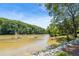 Beautiful river view with rocky banks, providing a serene and natural landscape for relaxation at 1023 Riverbend Club Se Dr, Atlanta, GA 30339