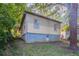 Exterior shot of backyard showing the homes siding and foundation at 132 Brownlee Sw Rd, Atlanta, GA 30331