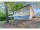 Exterior shot of backyard showing the homes siding and foundation at 132 Brownlee Sw Rd, Atlanta, GA 30331