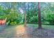 Spacious backyard featuring mature trees and shade for outdoor enjoyment at 132 Brownlee Sw Rd, Atlanta, GA 30331