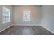 Neutral bedroom offers plenty of natural light and durable wood-look floors at 132 Brownlee Sw Rd, Atlanta, GA 30331