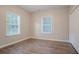 Bedroom with hardwood floors and closet. Window light adds warmth to the room at 132 Brownlee Sw Rd, Atlanta, GA 30331