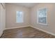 Bright bedroom featuring hardwood floors, neutral walls, and natural light at 132 Brownlee Sw Rd, Atlanta, GA 30331