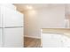 Modern kitchen area showcasing granite counters, white appliances, and natural light at 132 Brownlee Sw Rd, Atlanta, GA 30331