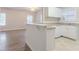 Eat in kitchen featuring white cabinets, granite countertops, and modern appliances at 132 Brownlee Sw Rd, Atlanta, GA 30331