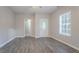 Open-concept living area featuring wood floors and a view of the entry door at 132 Brownlee Sw Rd, Atlanta, GA 30331