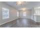 Bright living room featuring hardwood floors, natural light from windows, and ceiling fan at 132 Brownlee Sw Rd, Atlanta, GA 30331