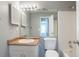 Bathroom with updated vanity, mirror, and lighting fixtures at 1377 Mill Lake Cir, Stone Mountain, GA 30088