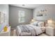 Cozy bedroom with neutral walls, bedside tables and warm decorative accents at 1377 Mill Lake Cir, Stone Mountain, GA 30088