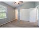 Bedroom featuring a vaulted ceiling, ceiling fan, and closet at 1377 Mill Lake Cir, Stone Mountain, GA 30088