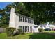 Two-story home with black shutters, well-kept lawn, and driveway with garage at 1377 Mill Lake Cir, Stone Mountain, GA 30088