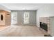 Bright living room features brick fireplace, neutral walls, and natural light at 1377 Mill Lake Cir, Stone Mountain, GA 30088