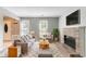 Bright living room with neutral walls, a brick fireplace, and lots of natural light at 1377 Mill Lake Cir, Stone Mountain, GA 30088