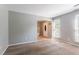 Spacious living room with neutral walls, plush carpet, and lots of natural light at 1377 Mill Lake Cir, Stone Mountain, GA 30088