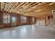 Unfinished basement with exposed framing and natural light ready to be customized at 2090 Beckham St, Cumming, GA 30041