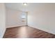 Clean, spacious bedroom with sleek dark wood flooring and natural light at 2090 Beckham St, Cumming, GA 30041