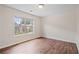 Bright bedroom with large window and hardwood flooring at 2090 Beckham St, Cumming, GA 30041