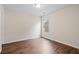 Bedroom featuring hardwood floors, natural light, and neutral paint scheme at 2090 Beckham St, Cumming, GA 30041