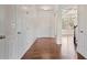 Bright foyer features hardwood floors, white trim, and arched doorway into adjacent room at 2090 Beckham St, Cumming, GA 30041