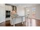 The kitchen features stainless steel appliances, granite countertops and an adjacent dining area at 2090 Beckham St, Cumming, GA 30041