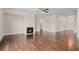 Open-concept living room features fireplace, hardwood floors, and seamless flow to the foyer and kitchen at 2090 Beckham St, Cumming, GA 30041