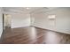 Spacious living room features hardwood floors, natural light, and neutral paint scheme at 2090 Beckham St, Cumming, GA 30041