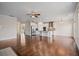 Expansive living space featuring hardwood floors, with an open layout connecting the living room and kitchen at 2090 Beckham St, Cumming, GA 30041