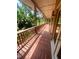 Long outdoor porch with serene views of wooded backyard at 2961 River Ridge Drive Sw, Atlanta, GA 30354