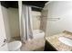 Bathroom featuring a tiled shower-tub combo, granite vanity, and sink at 2961 River Ridge Drive Sw, Atlanta, GA 30354