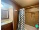 Bathroom features a tiled shower-tub combo with granite vanity and sink at 2961 River Ridge Drive Sw, Atlanta, GA 30354