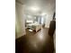 Spacious bedroom featuring hardwood floors, gray walls, and natural light at 2961 River Ridge Drive Sw, Atlanta, GA 30354